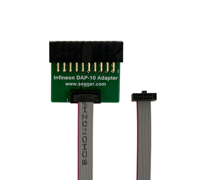 Infineon Aurix DAP-10 Adapter Image of an Infineon DAP-10 Adapter, featuring a rectangular green circuit board with pin connectors on top. Below, a short, flexible cable with a connector is visible, extending out to the right. The adapter is designed for electronic connections and debugging.